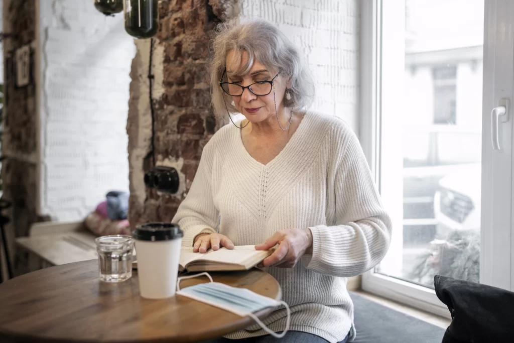 Senior woman reading a journal